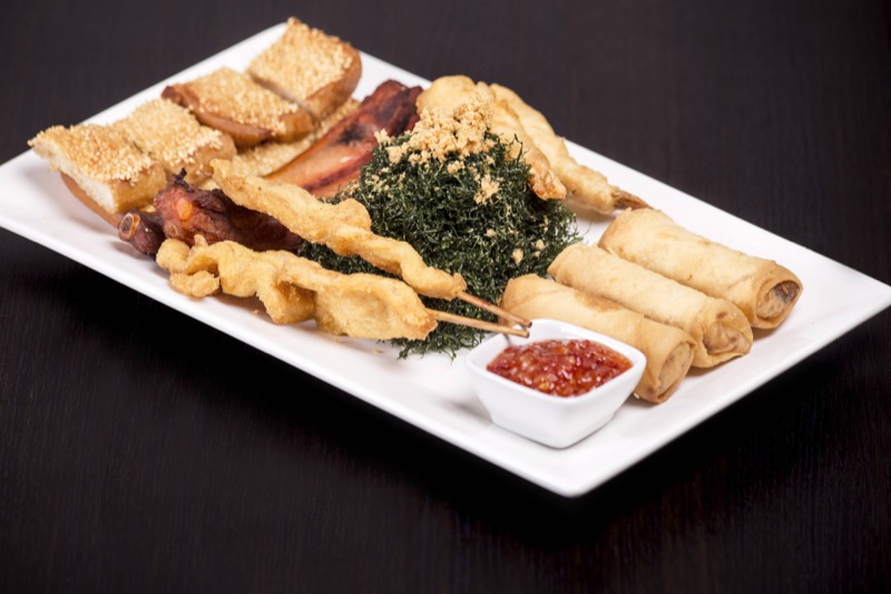 House platter of seaweed, spring rolls and satay chicken
